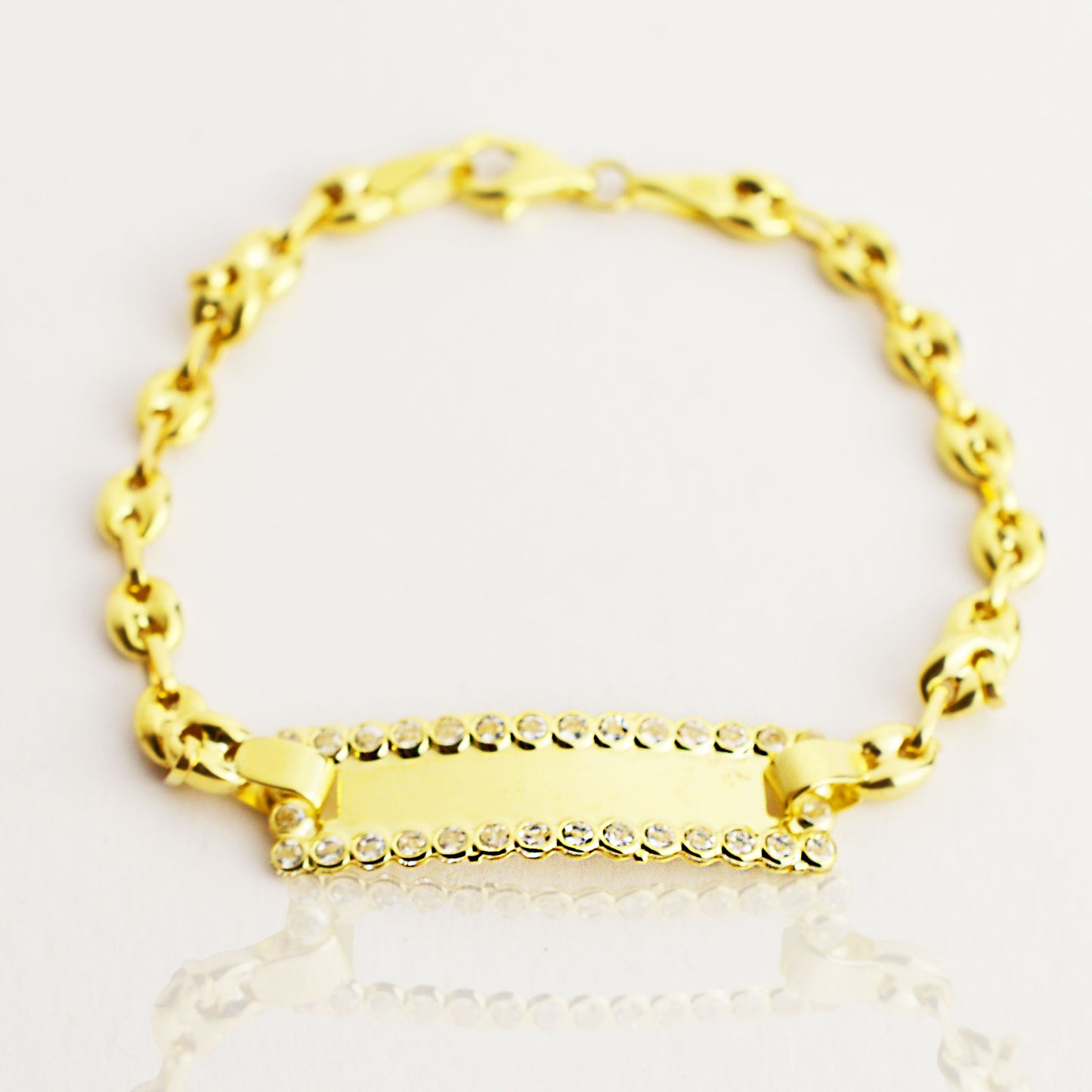 Women's gold bracelet with zirconium