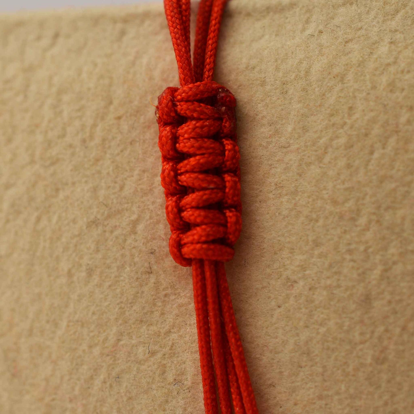 Gold on a red thread