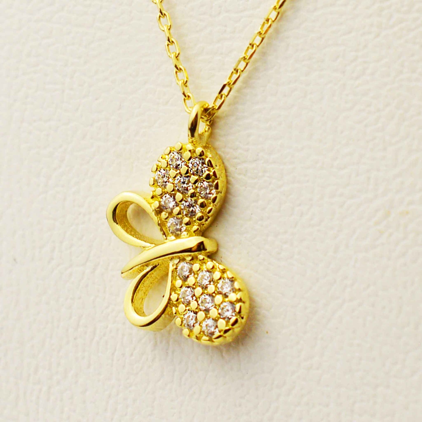 Gold necklace with a butterfly pendant