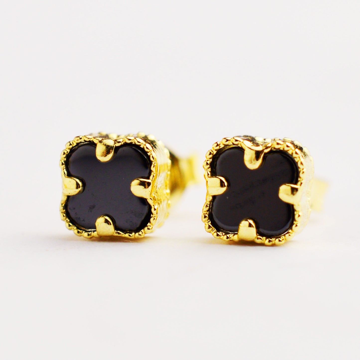 Gold women's earrings with screw type van cleef