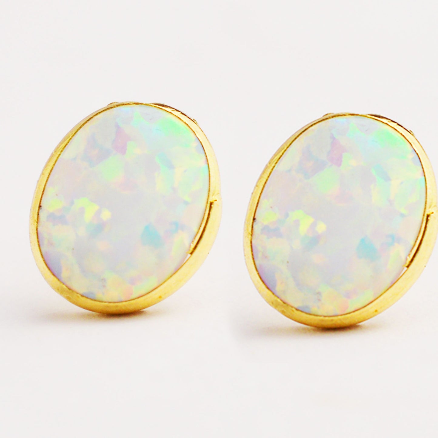 Women's gold earrings with opal