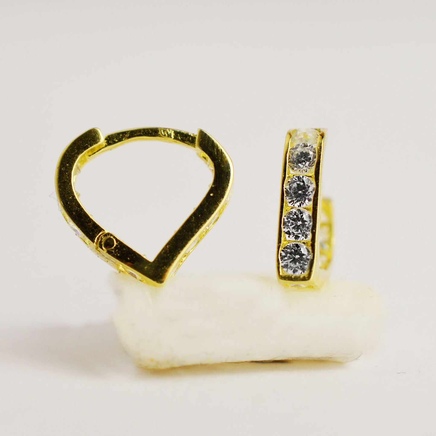 Gold children's earrings in the shape of a heart