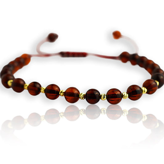 Gold bracelet on thread with amber