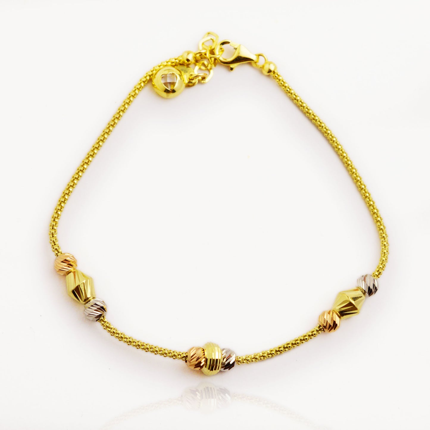 Gold bracelet made of white, yellow and rose gold