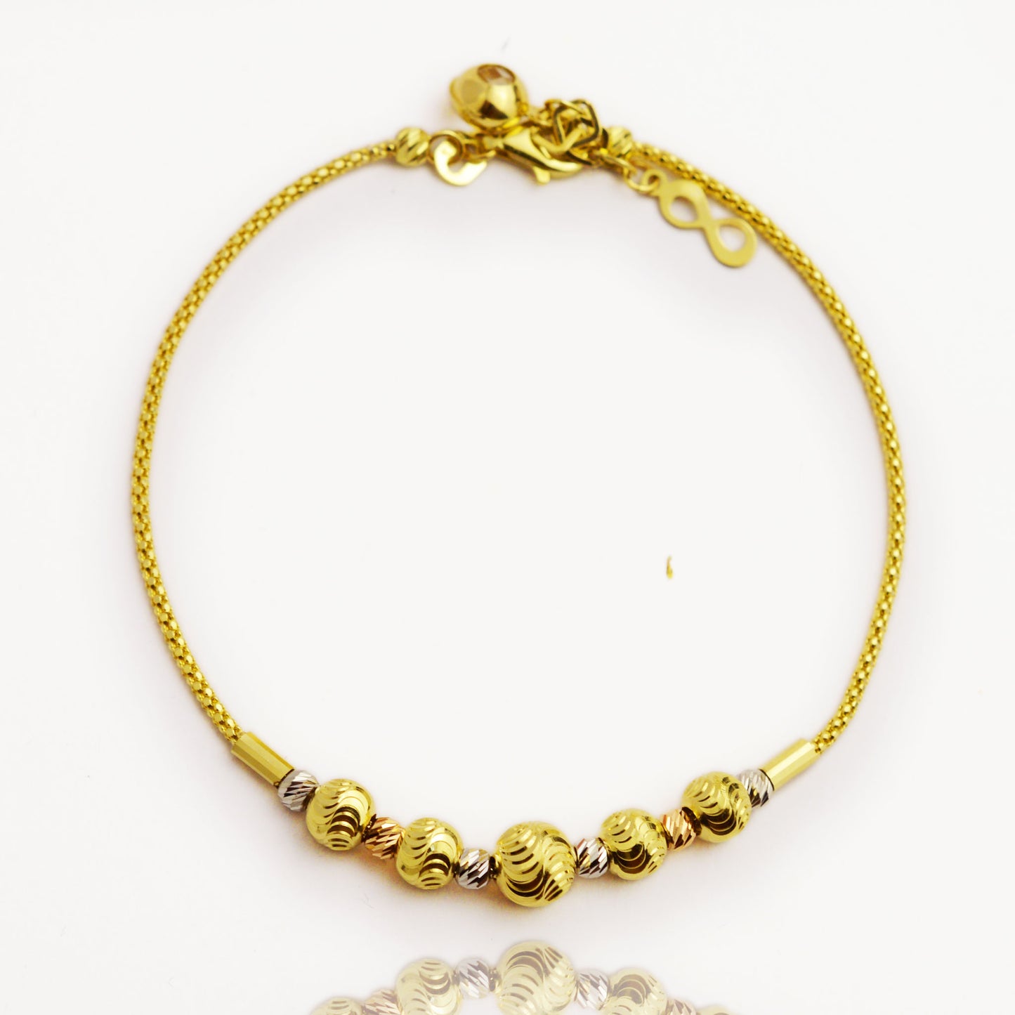 Gold bracelet made of white, yellow and rose gold