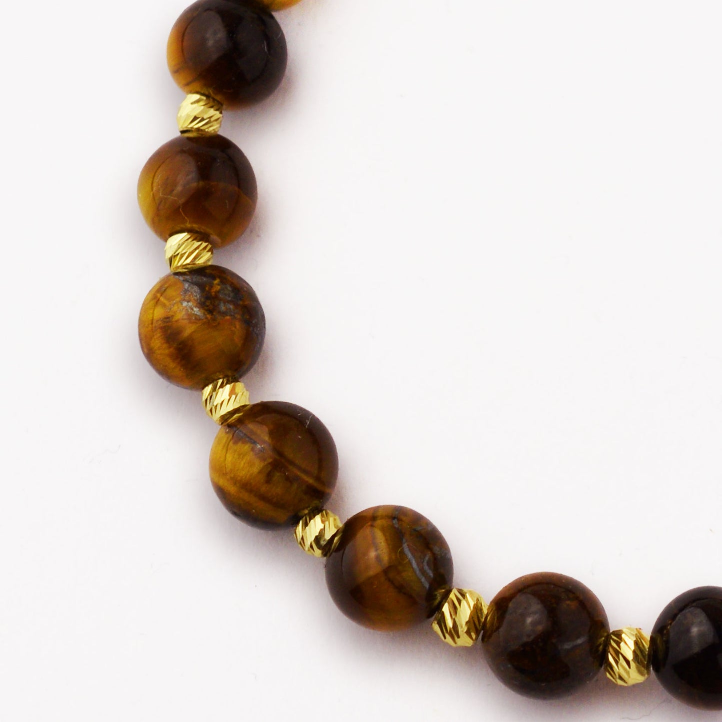 Злато на конец с тигрово око