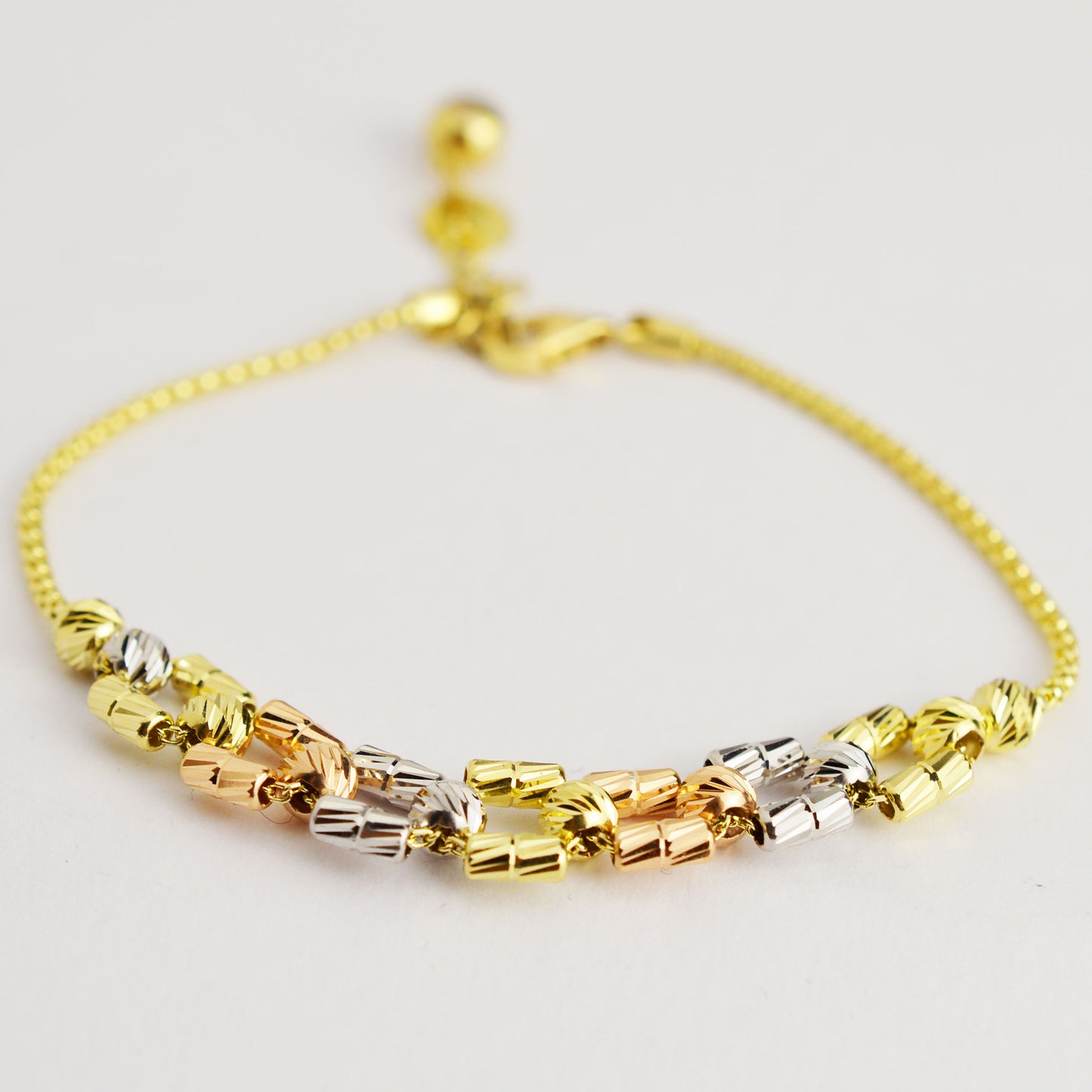 Gold bracelet made of white, yellow and rose gold
