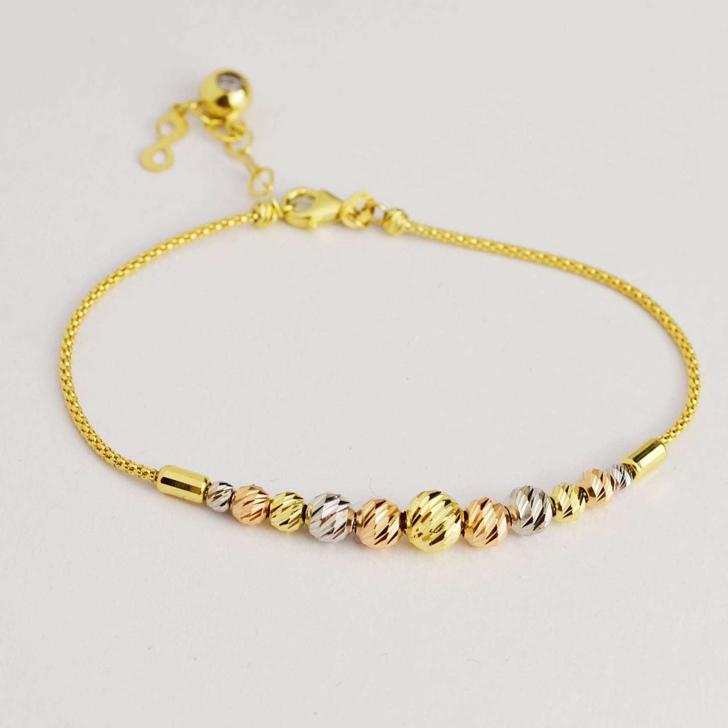 Gold bracelet made of white, yellow and rose gold