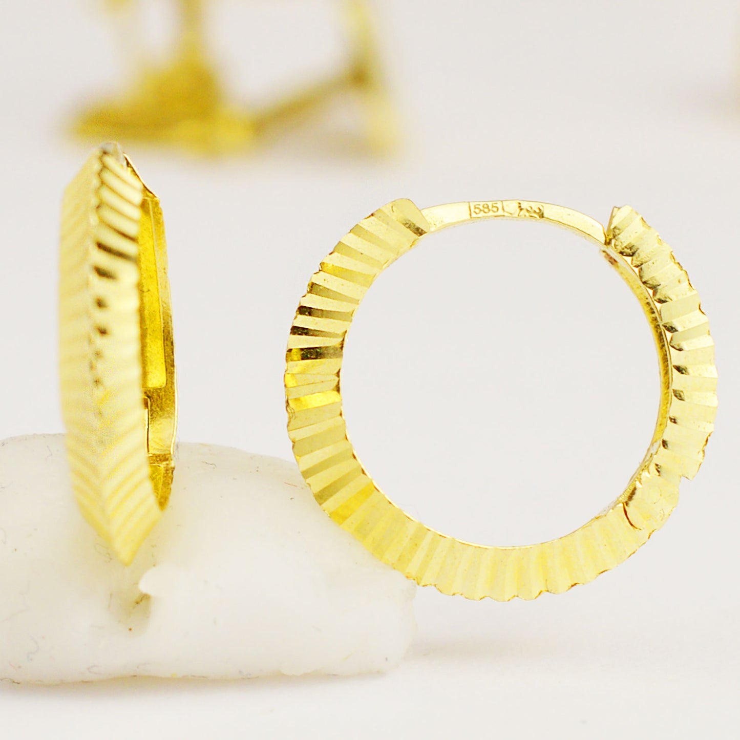 Women's gold hoop earrings