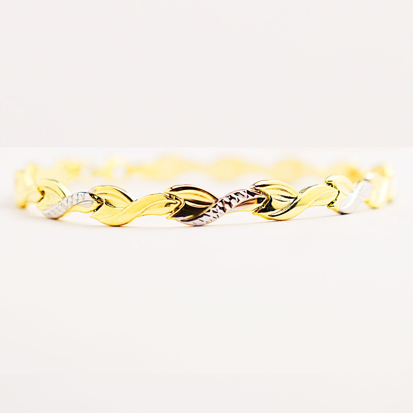 Women's gold bracelet made of white and yellow gold