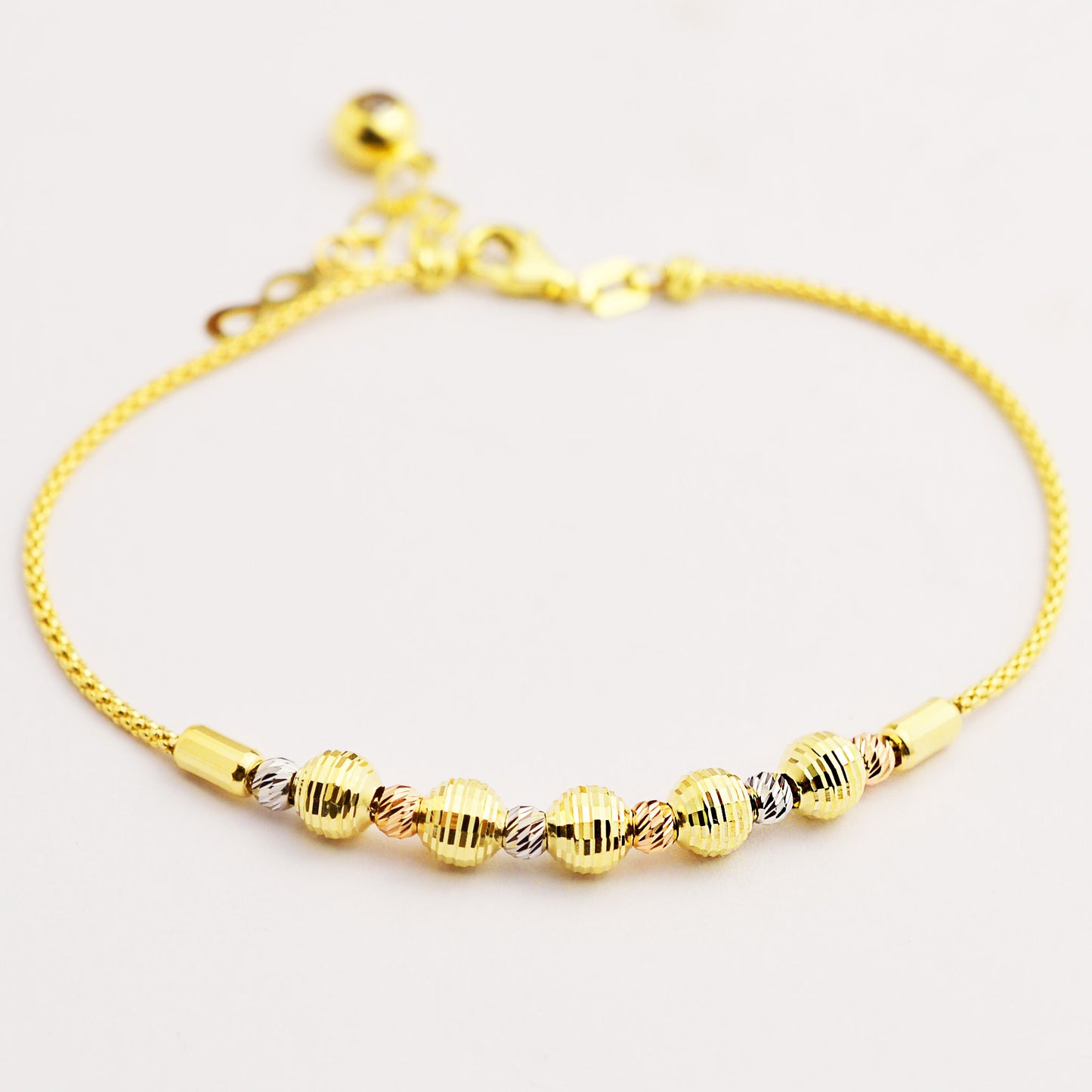 Women's gold bracelet made of white, rose and yellow gold