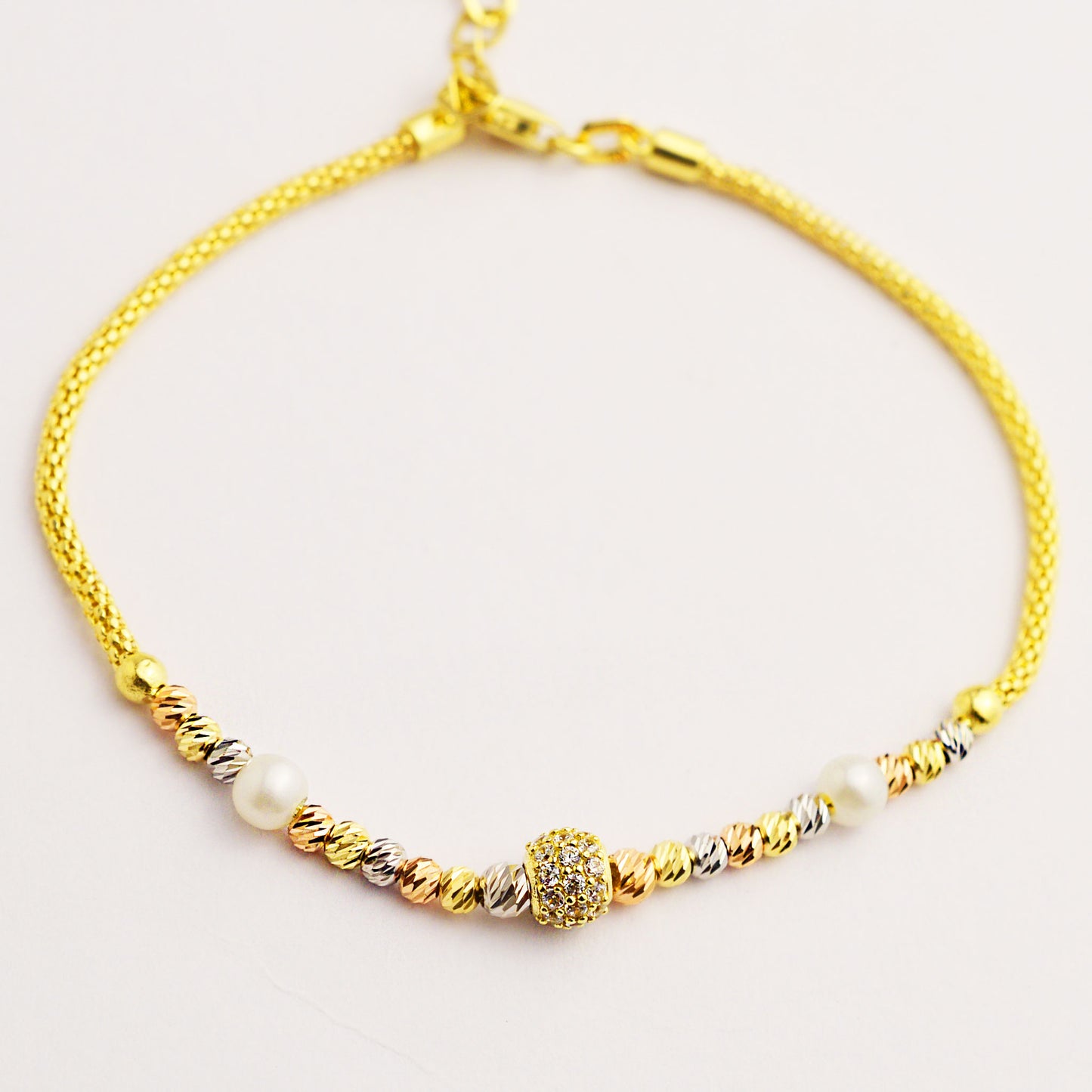 Gold women's bracelet with white pearl