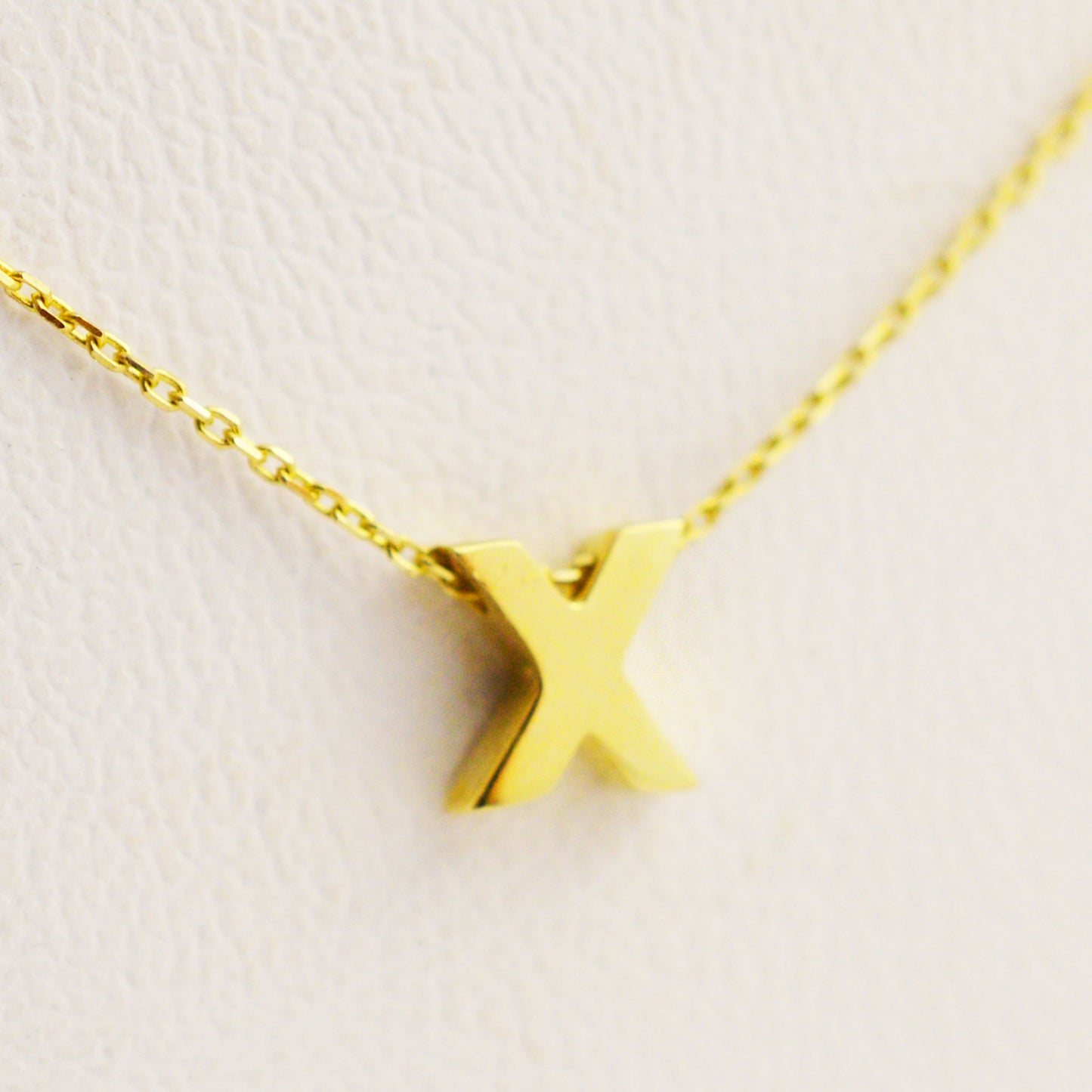 Gold necklace - letter 'X'