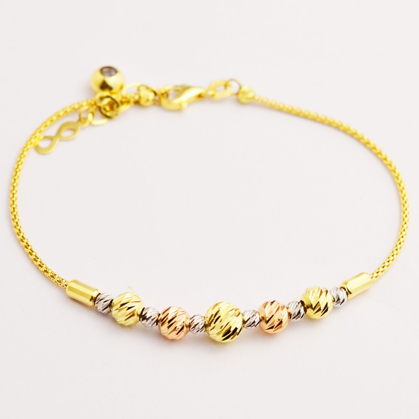 Women's gold bracelet made of white, rose and yellow gold