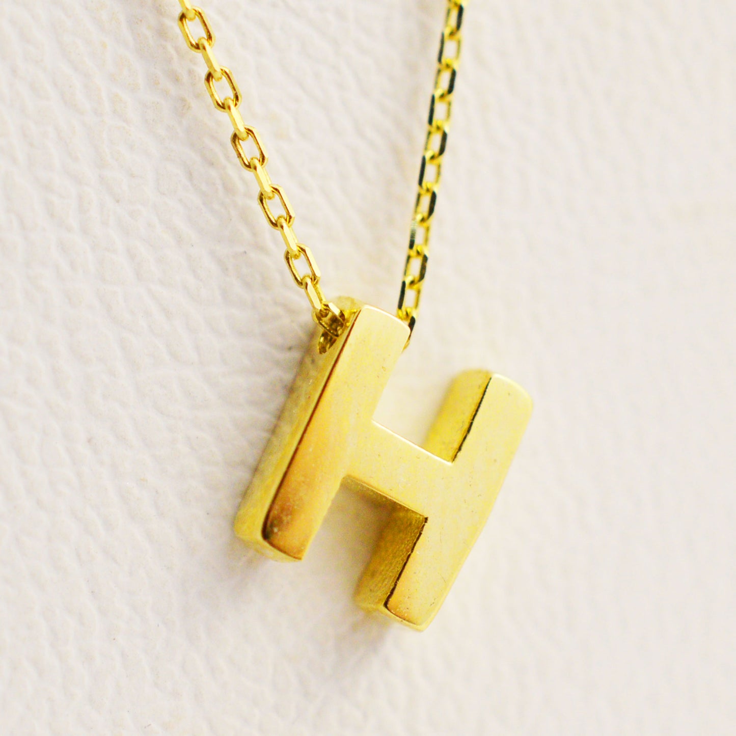 Gold necklace - letter 'H'