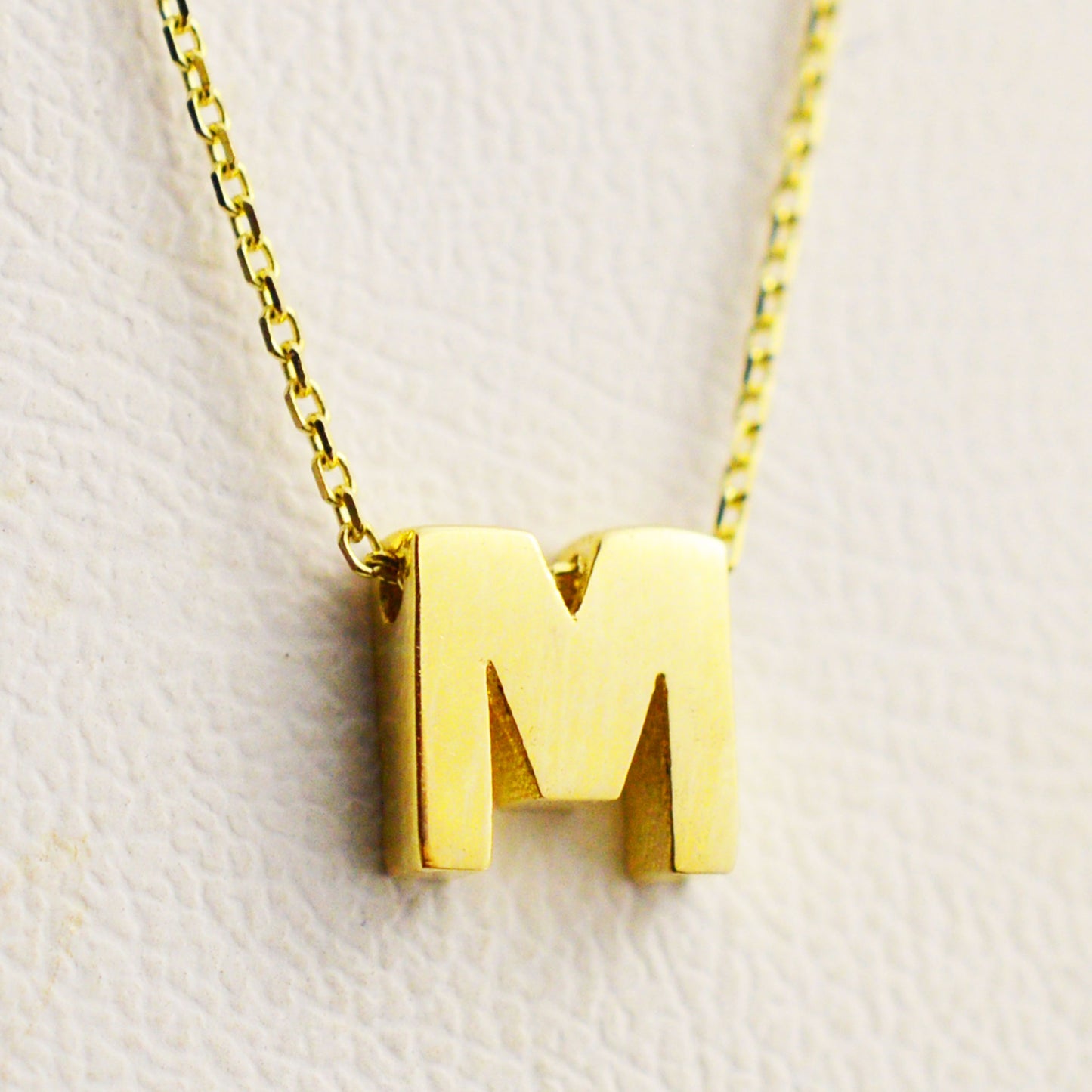 Gold necklace - letter 'M'