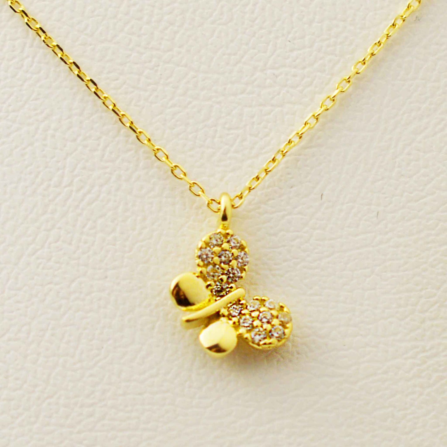 Gold necklace with a butterfly pendant