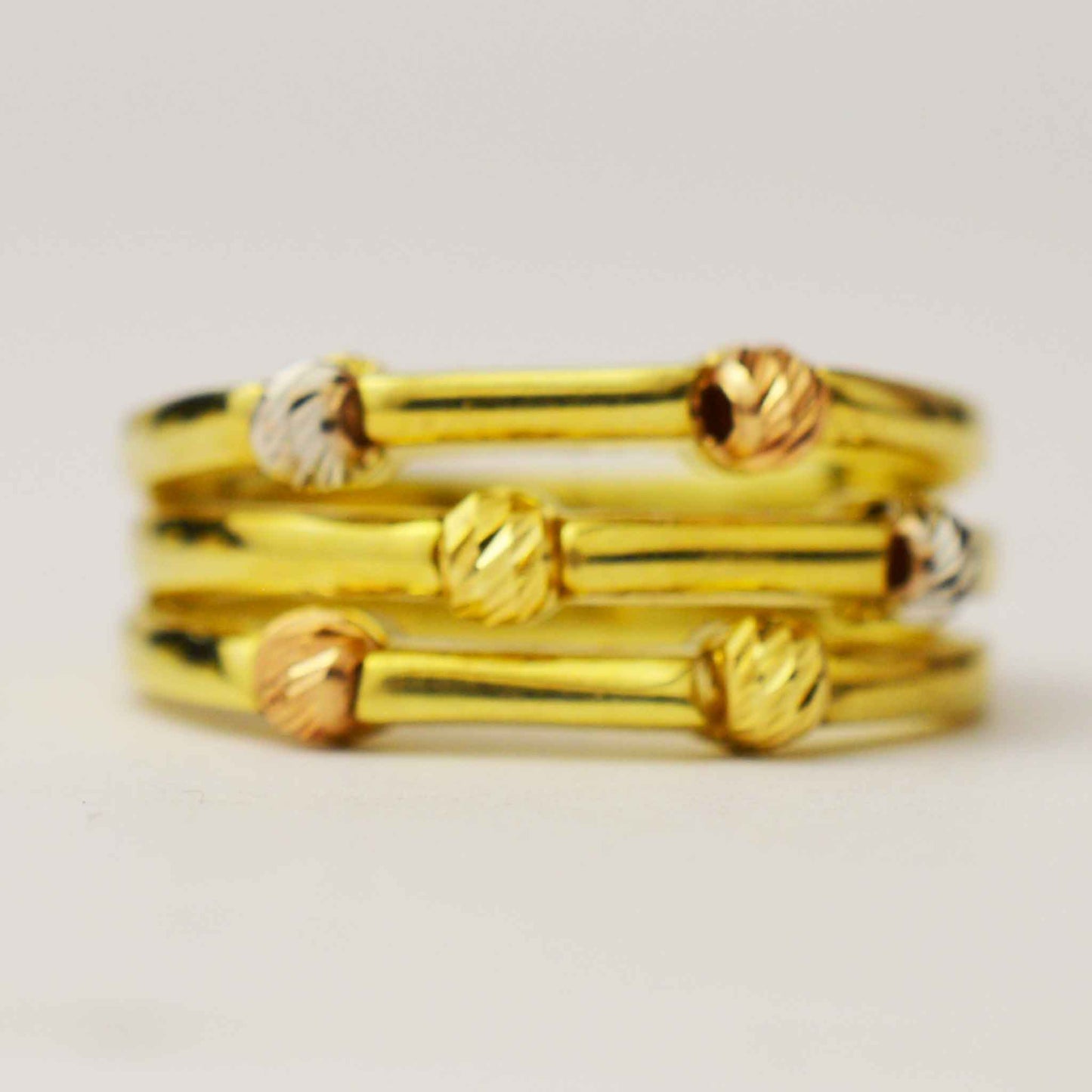 Gold ring with white, yellow and rose gold