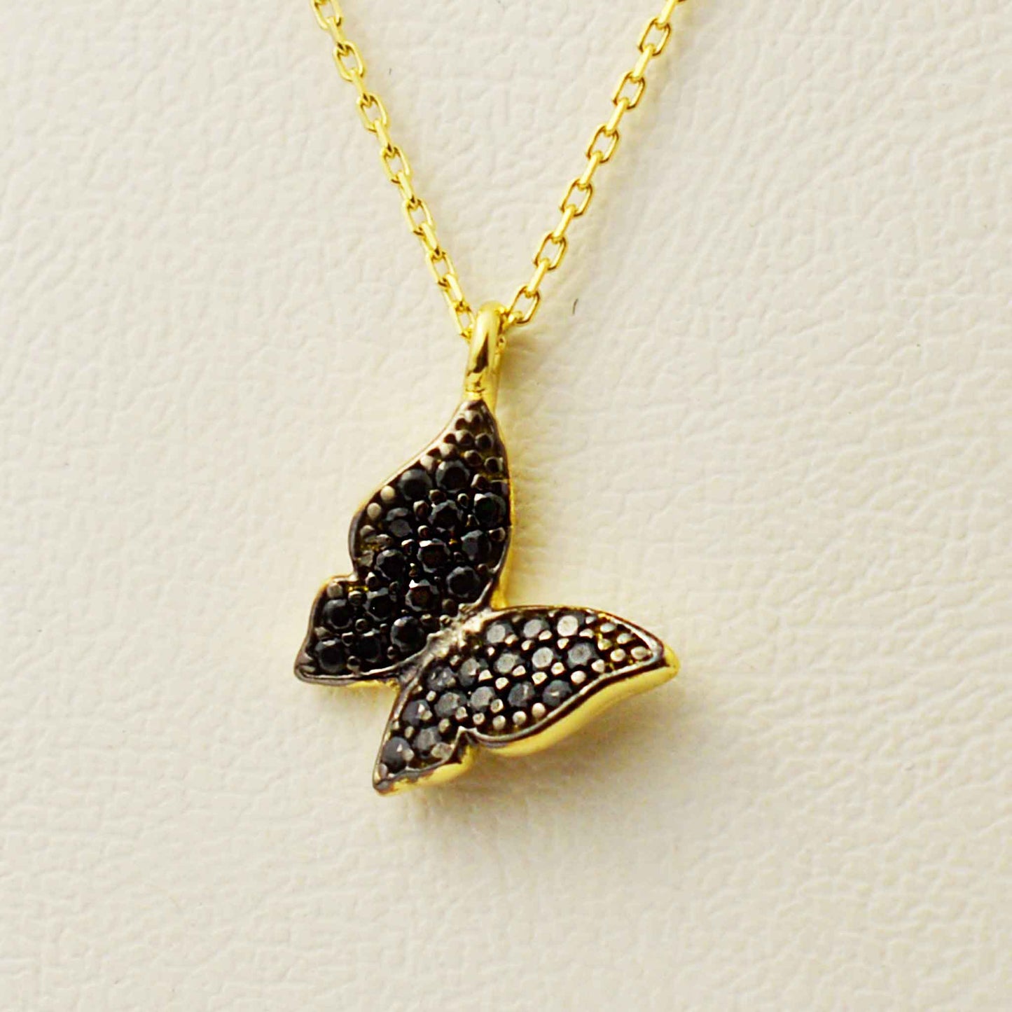 Gold necklace with a butterfly pendant