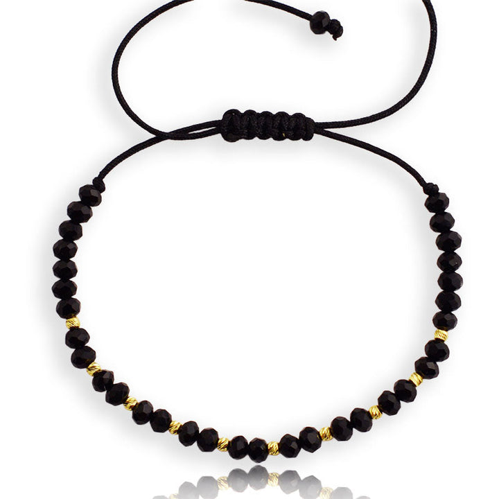 Gold on thread with onyx