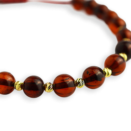 Gold bracelet on thread with amber 