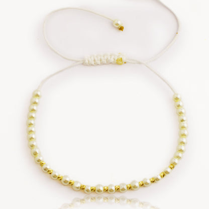 Gold on a pearl thread (small pearls)