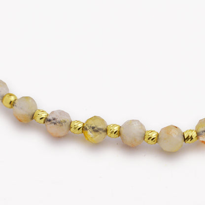 Злато на конец със слънчев камък