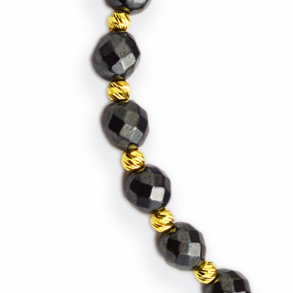 Gold on black thread with hematite