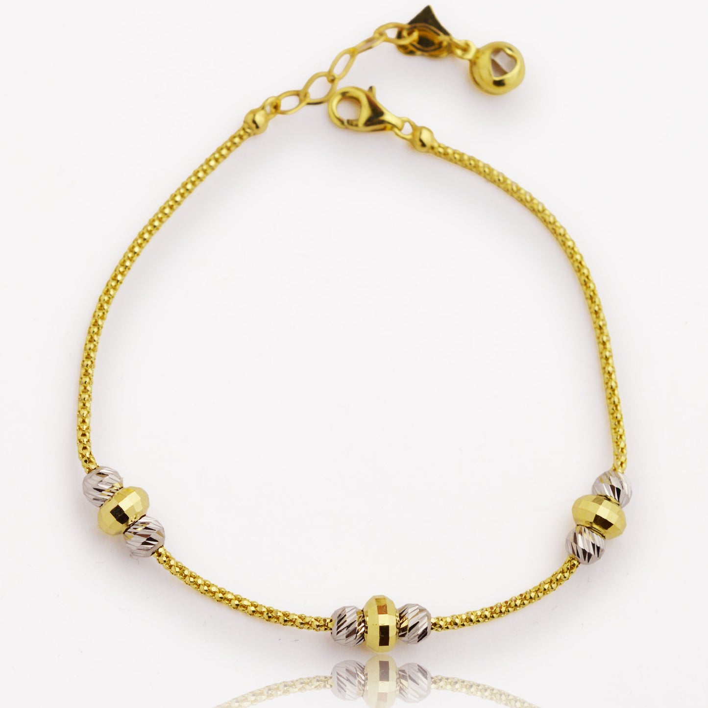 Златна гривна с бяло и жълто злато